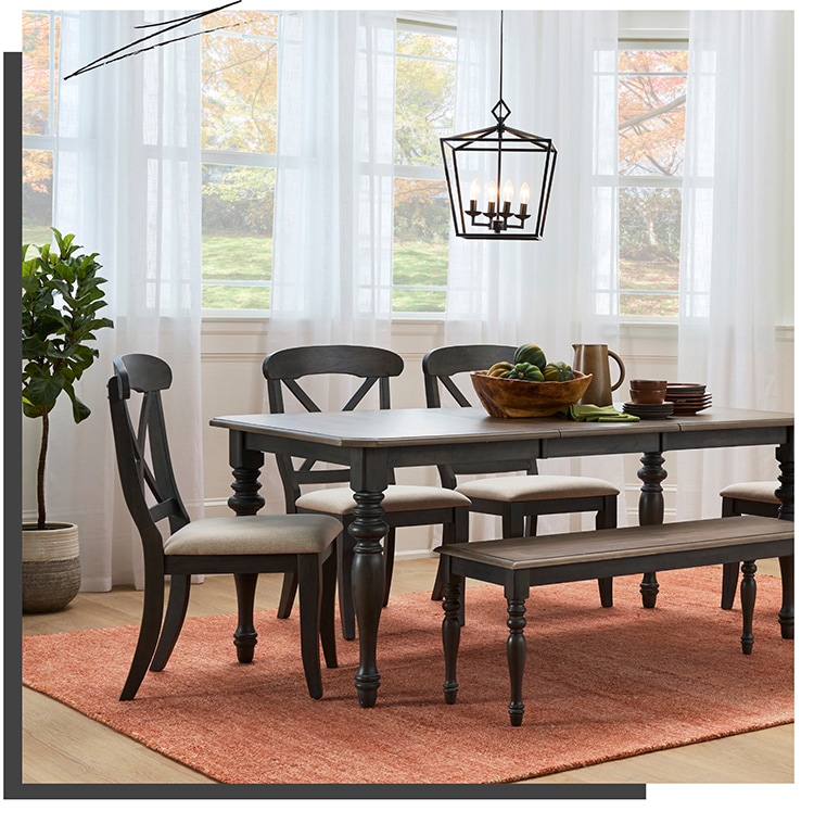 Dining room table setup inside a fall themed setting Bring in a bit of black