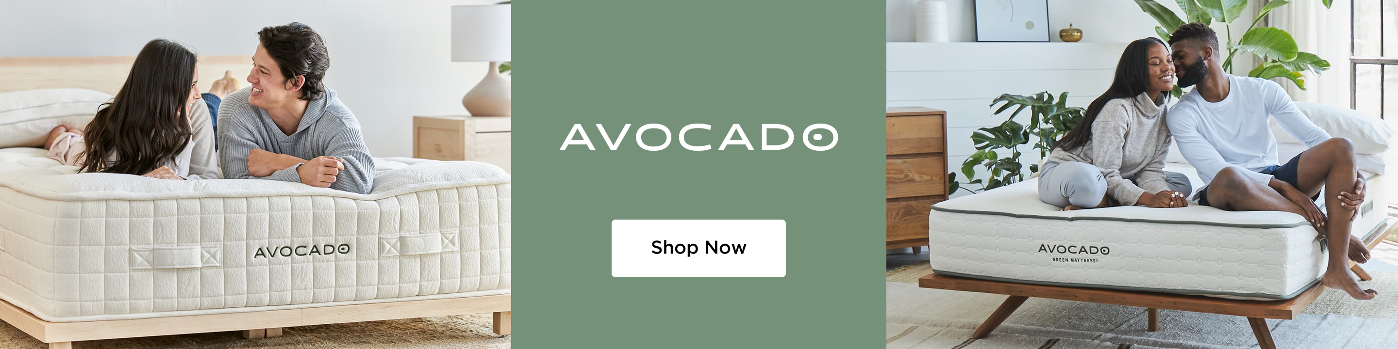 Avocado mattress with a female and male laying on top of it smiling at one another at the foot of the bed. Mattress is on a light wood bed frame.